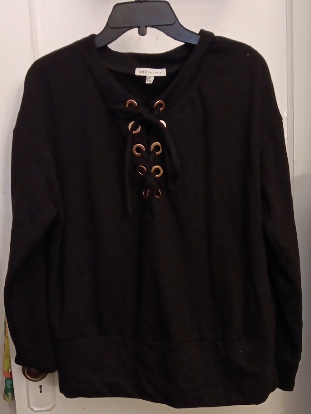 Socialite Black Pullover Top With Lace Up Neckline & Gold Eyelets.